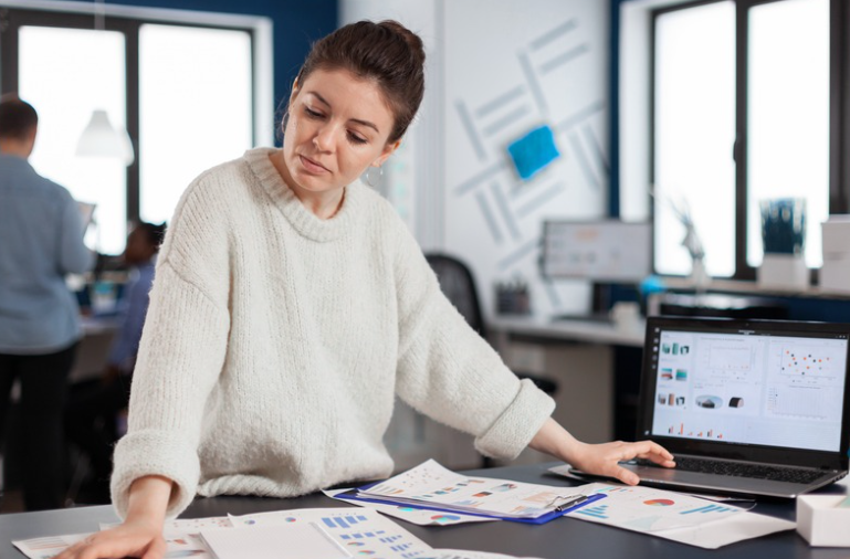 stressed business woman going over business figures 