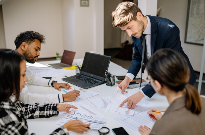 A team looking at the financial data and statistics