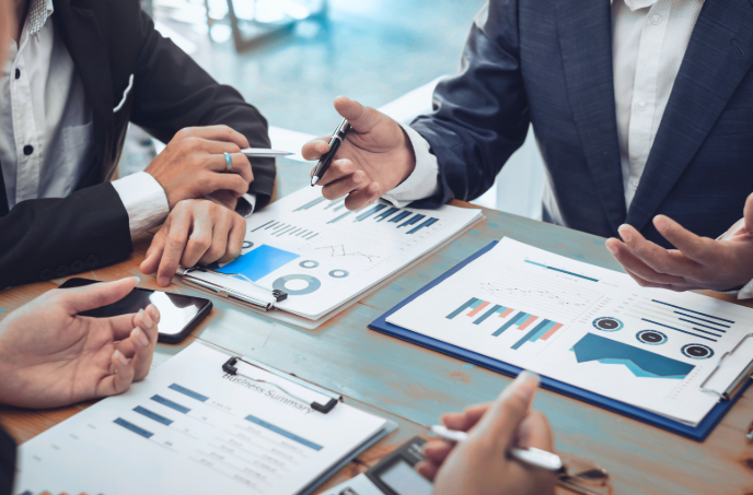Businessman Present Graph Financial Information at the Meeting