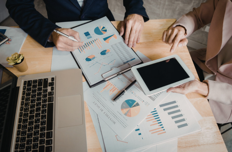 A group of business individuals analysing business data