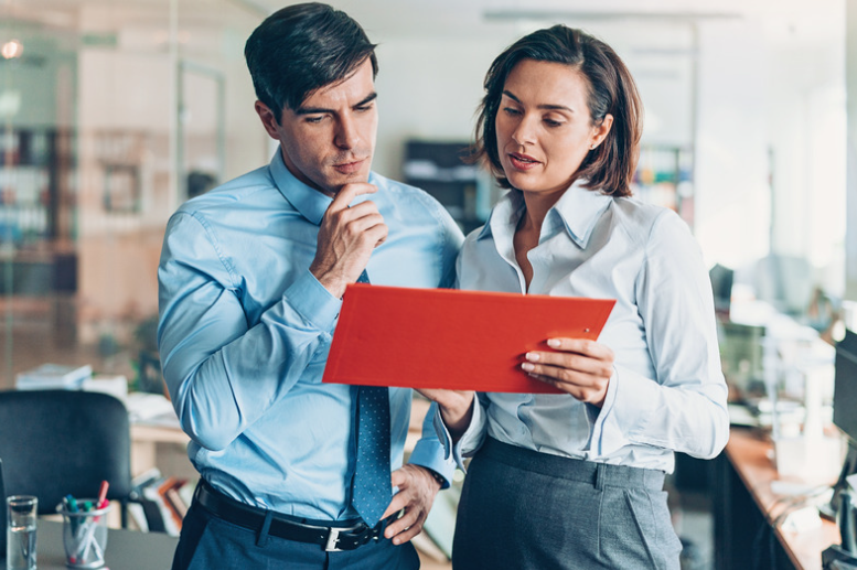 A couple of business people working together in the office