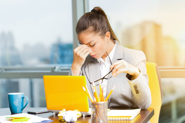 Businesswoman feeling tired and stressed.